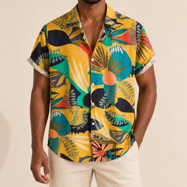 Model wearing a yellow short-sleeve shirt with teal and black botanical shapes