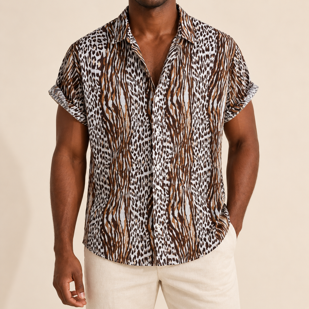 Model wearing brown, dark and pale short-sleeve shirt with narrow bands of animal markings