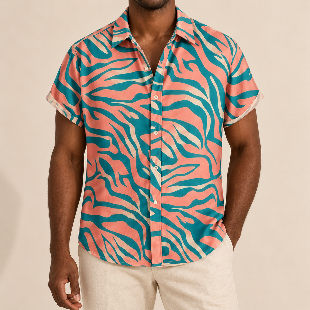 Model wearing coral short-sleeve shirt with teal zebra-style stripes