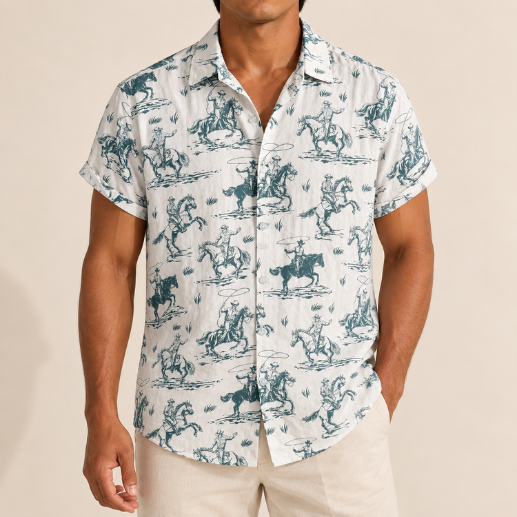 Model wearing a white short-sleeve shirt with teal horse and rider illustrations