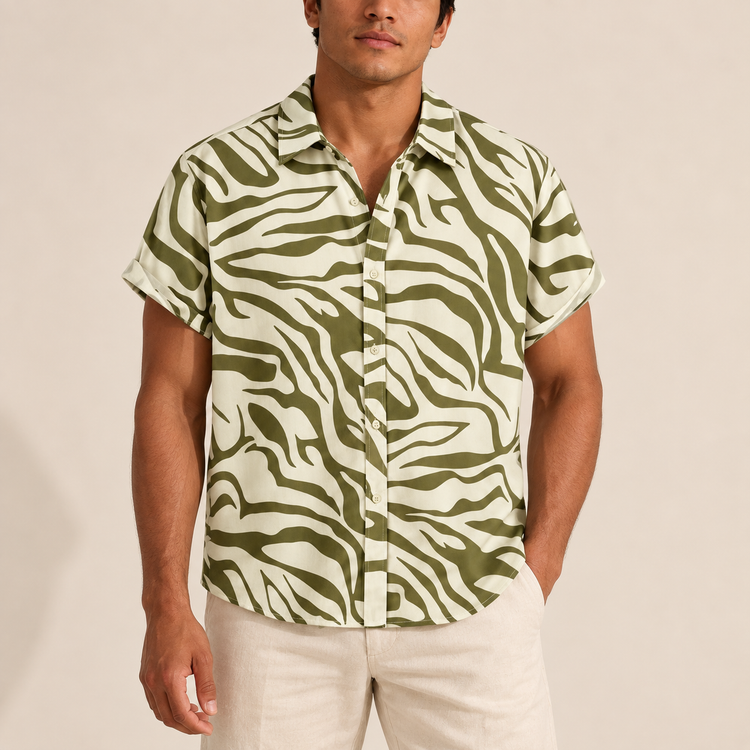 Model wearing cream short-sleeve shirt with olive zebra-style stripes