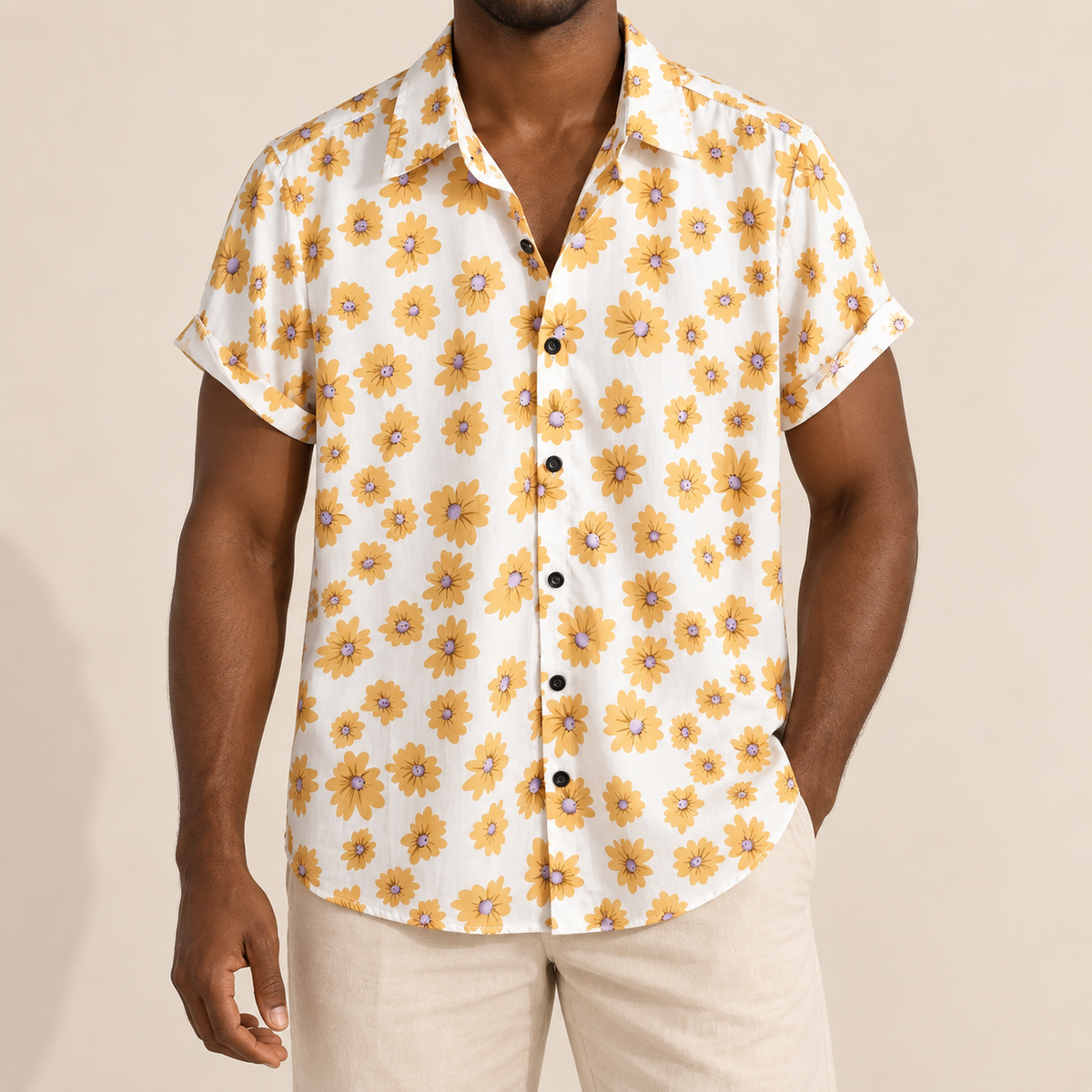 Model wearing a white short-sleeve shirt with yellow daisies
