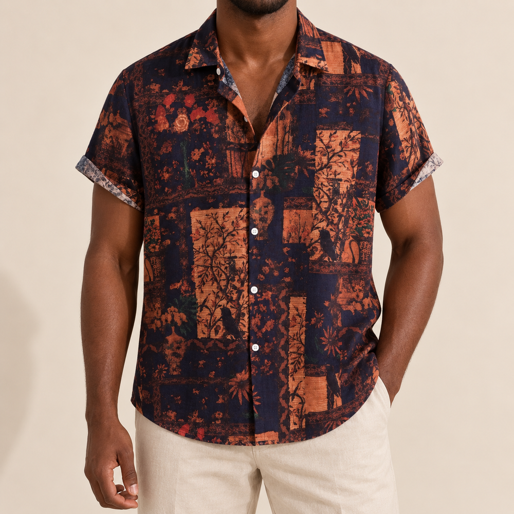 Model wearing a dark navy shirt with muted orange floral panels