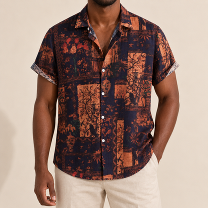 Model wearing a dark navy shirt with muted orange floral panels