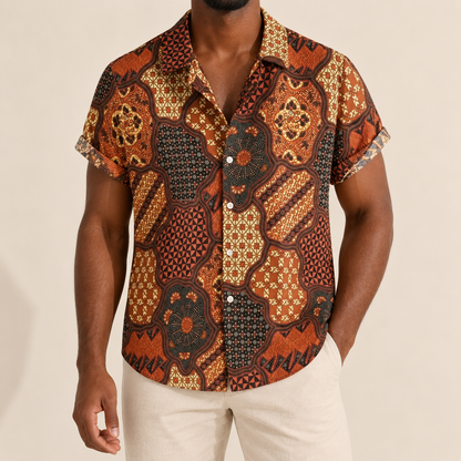 Model wearing a rust and brown medallion-print short-sleeve shirt