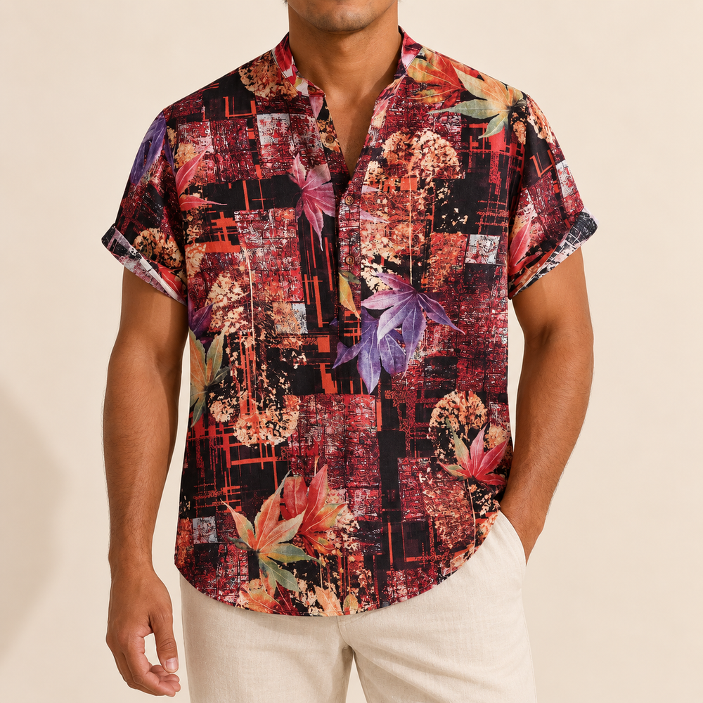 Model wearing a burgundy and black band-collar shirt with abstract floral panels