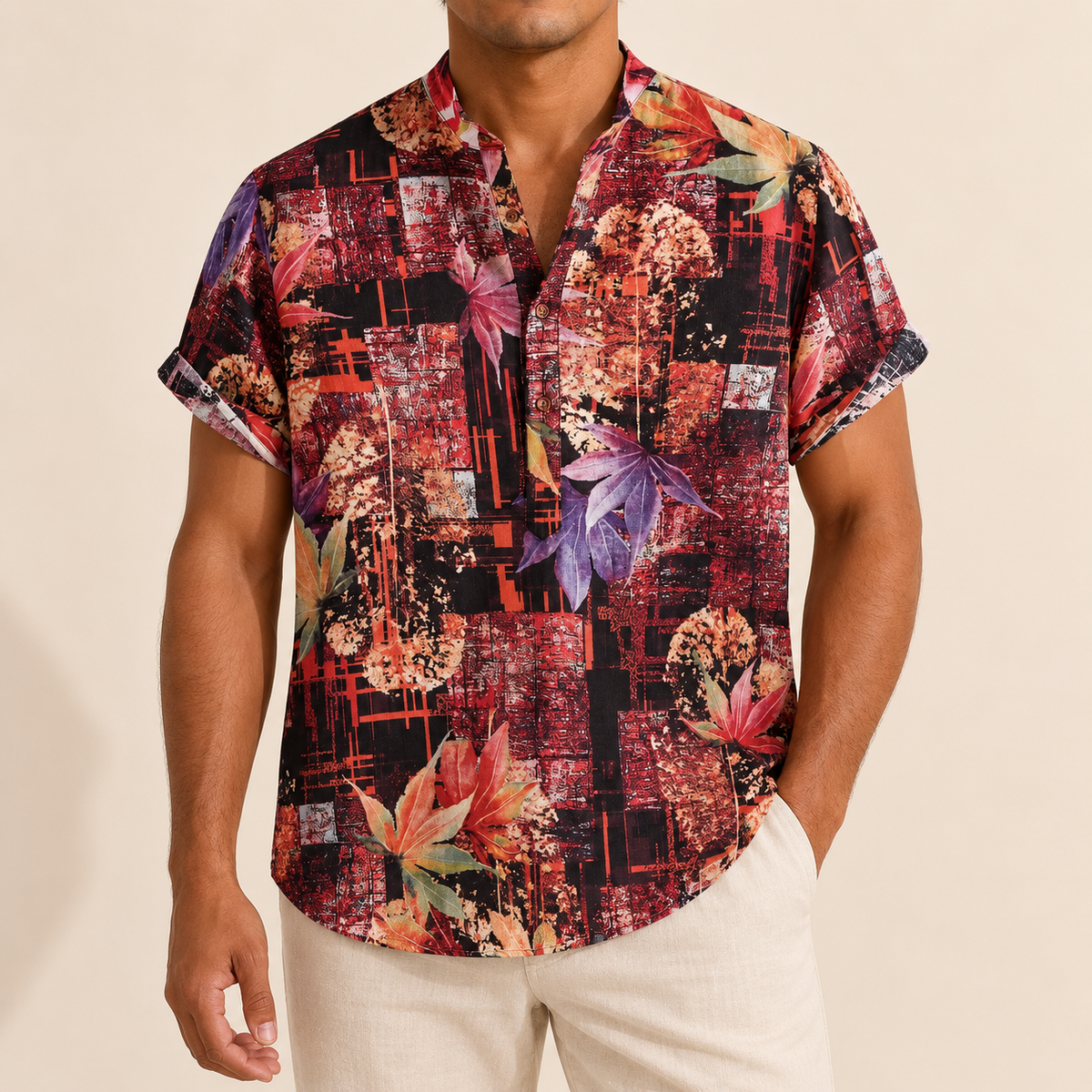 Model wearing a burgundy and black band-collar shirt with abstract floral panels