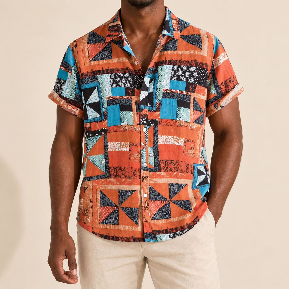 Model wearing a orange and teal geometric colorblock short-sleeve shirt