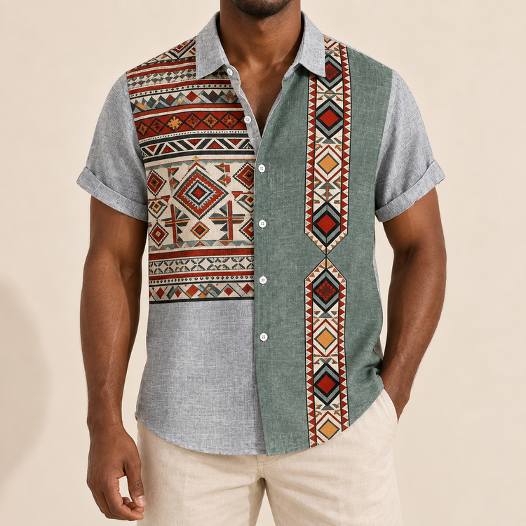 Model wearing gray short-sleeve shirt with orange-accented geometric panels and a vertical border