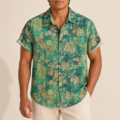 Model wearing a green short-sleeve shirt with gold floral motifs and a chest pocket