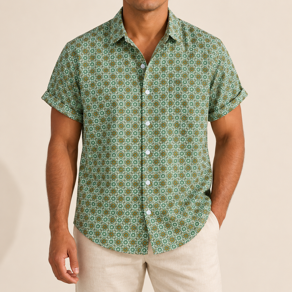 Model wearing green short-sleeve shirt with small repeating rounded floral motifs