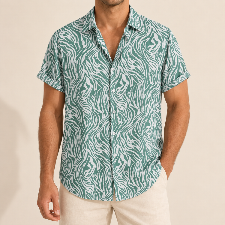 Model wearing a green and white animal-stripe short-sleeve button-up shirt