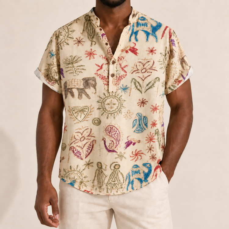 Model wearing a cream band-collar shirt with colorful illustrated motifs