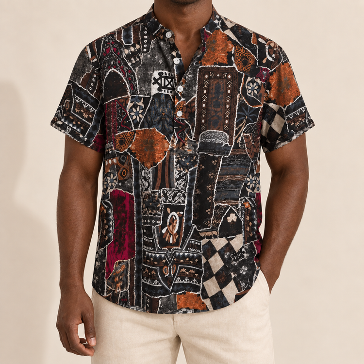 Model wearing a dark band-collar shirt with abstract shapes and rust accents