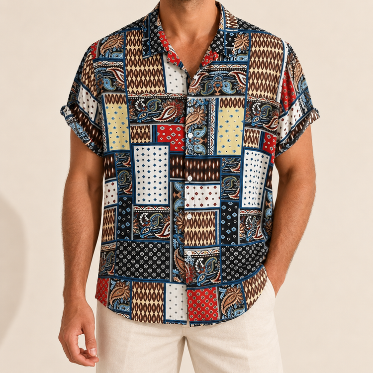 Model wearing a short-sleeve shirt with navy, cream and red patchwork patterns