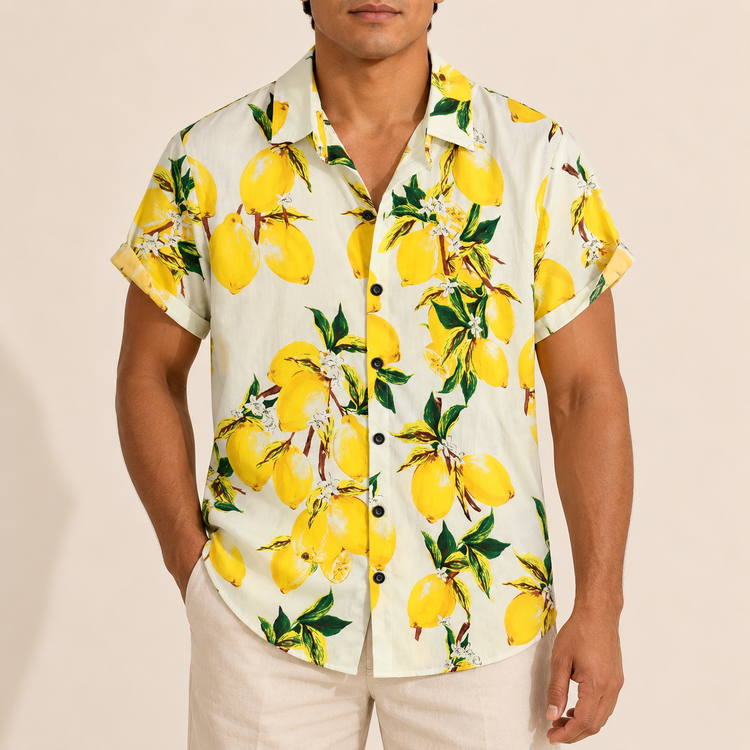Model wearing a cream short-sleeve shirt with yellow lemons and green leaves