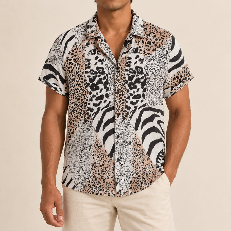 Model wearing pale and dark short-sleeve shirt with panels of animal spots and zebra stripes