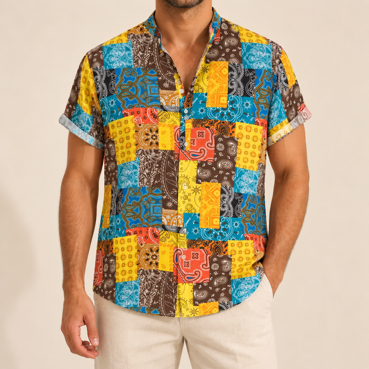 Model wearing a short-sleeve party shirt with bright multicolored patchwork-style squares