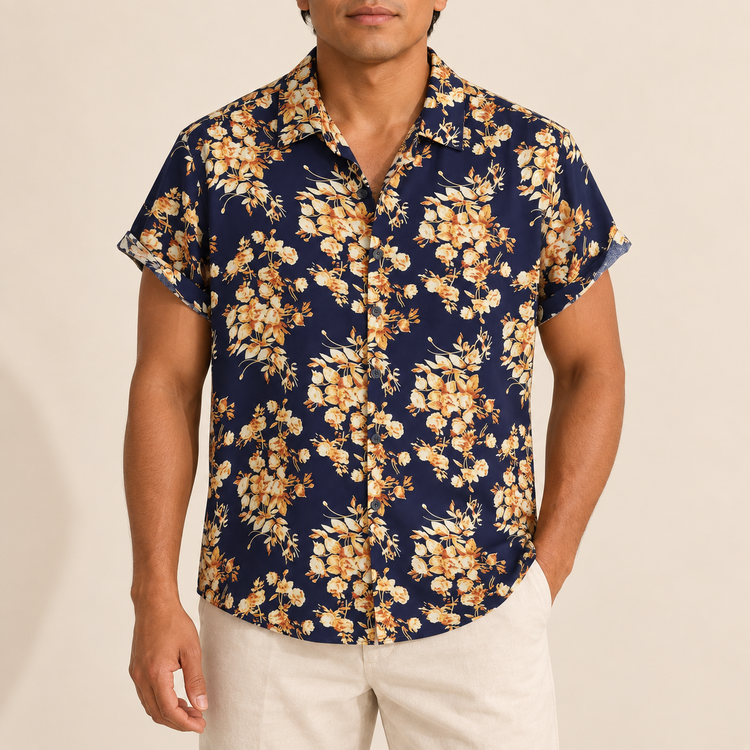 Model wearing navy short-sleeve shirt with gold-toned floral branches