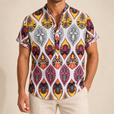 Model wearing a white band-collar shirt with colorful teardrop ornaments