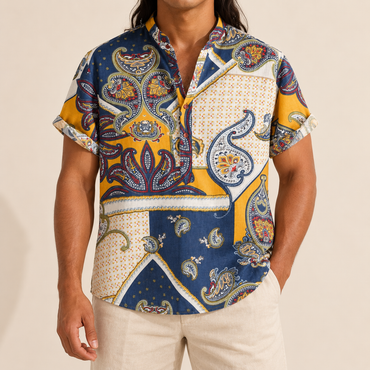 Model wearing a navy, yellow and cream paisley panel shirt