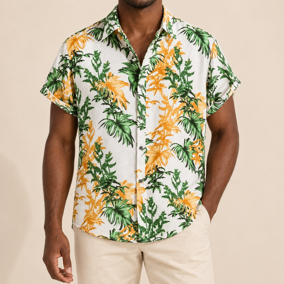 Model wearing a white short-sleeve shirt with green and golden-yellow palm clusters