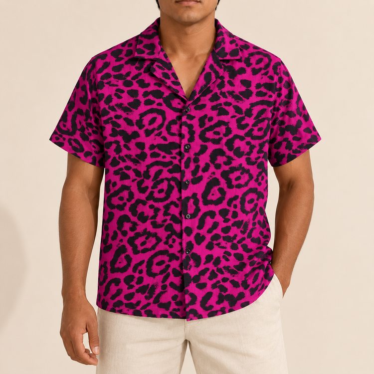Model wearing bright pink short-sleeve shirt with dark leopard-like spots