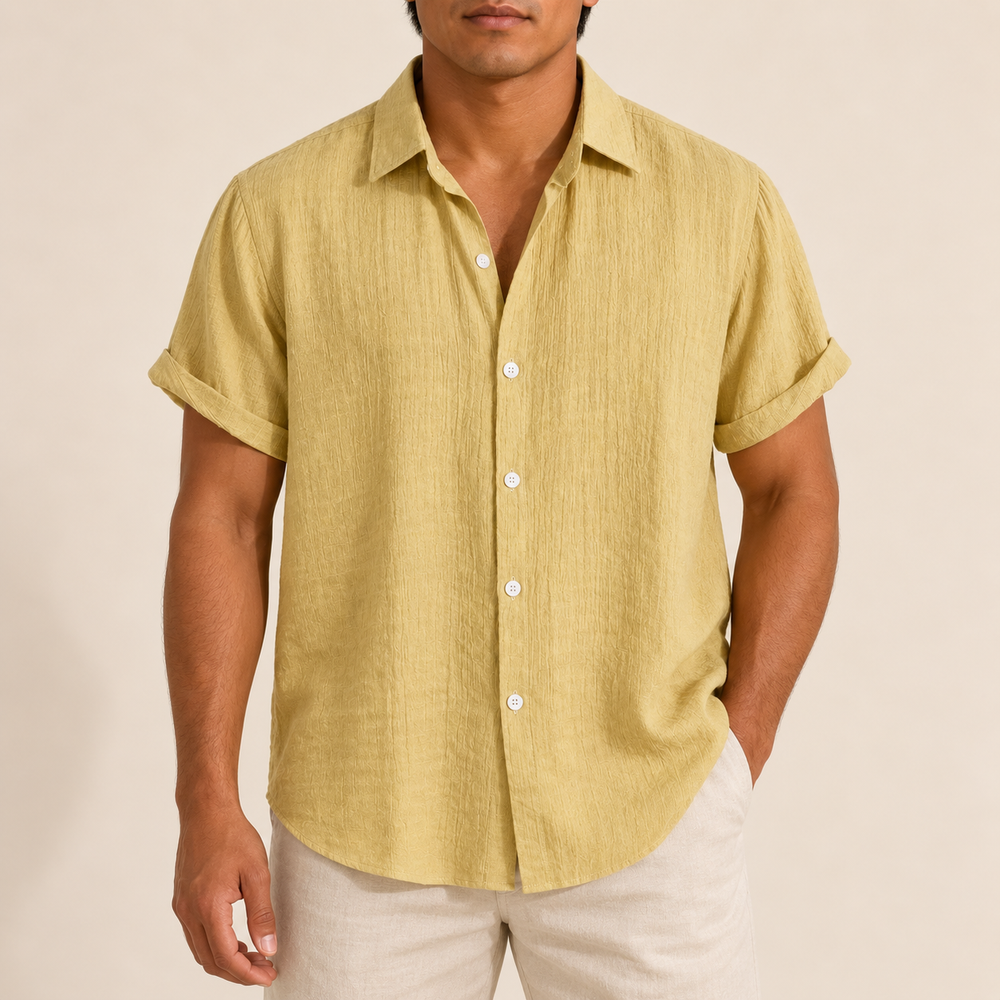 Model wearing a yellow textured short-sleeve button-up shirt