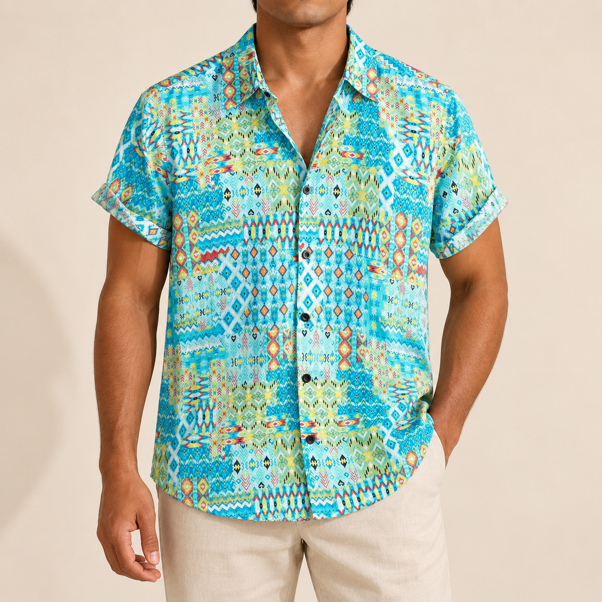Model wearing a turquoise short-sleeve shirt with multicolored geometric borders