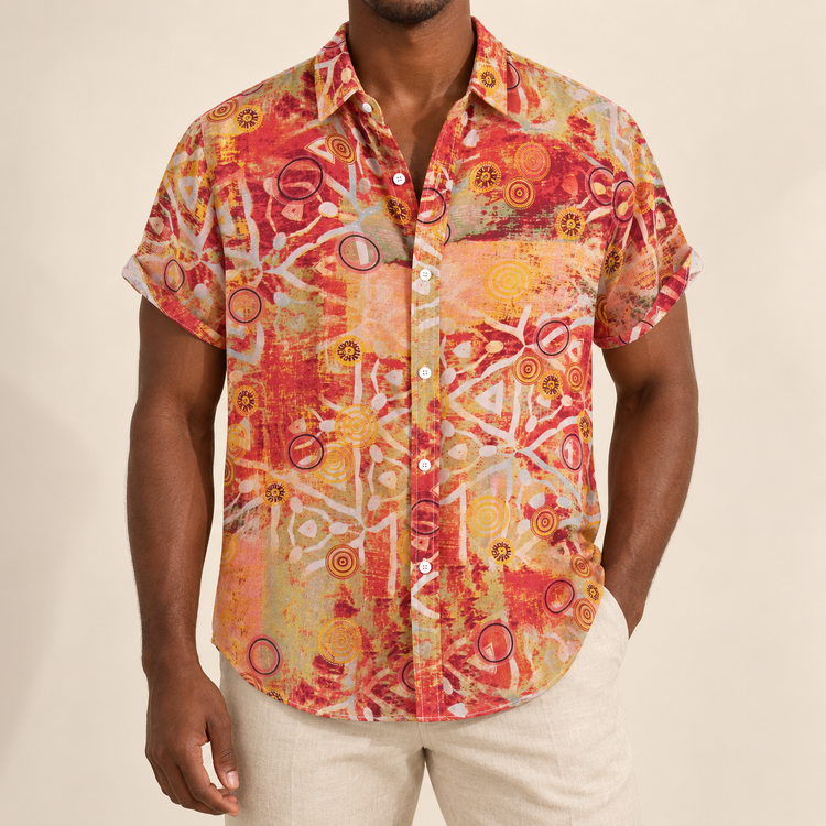 Model wearing a orange and red geometric-print short-sleeve shirt