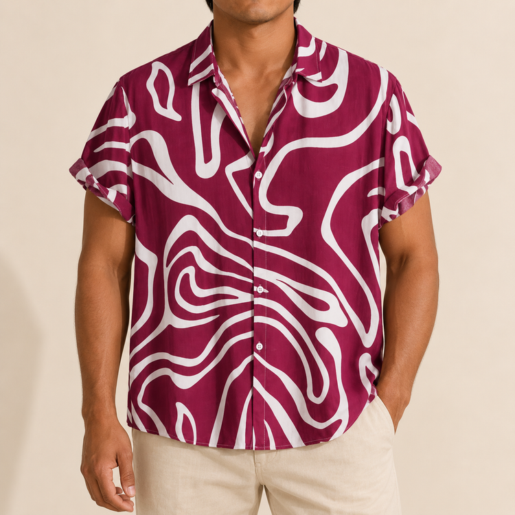 Model wearing a burgundy short-sleeve shirt with white wavy lines