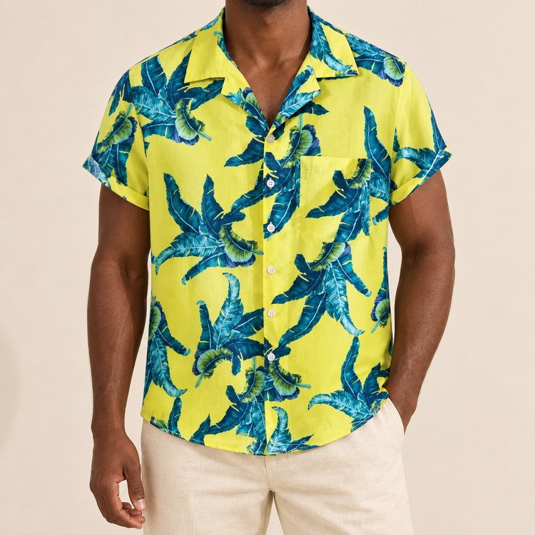 Model wearing a yellow short-sleeve shirt with blue-green leaves