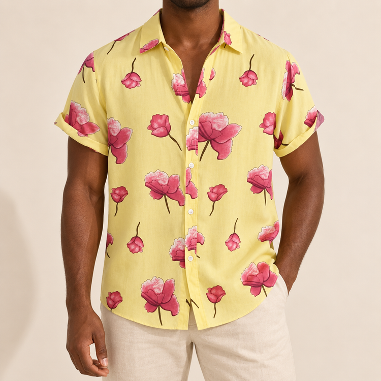 Model wearing a pale yellow short-sleeve shirt with pink roses
