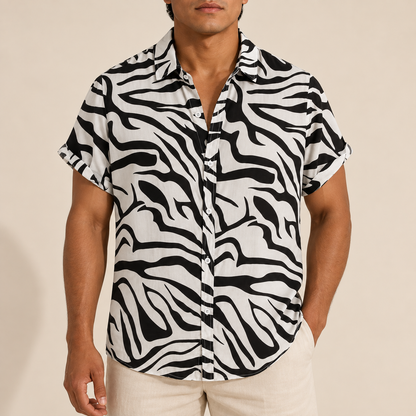 Model wearing a black and white zebra-print short-sleeve shirt